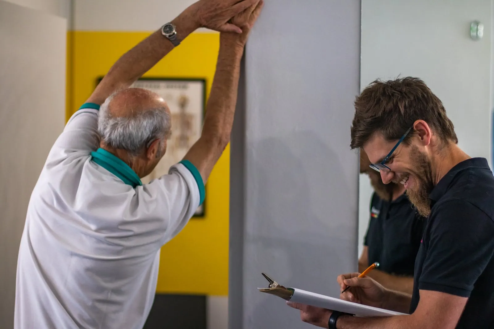 An older adult working through a supervised mobility assessment with a Movewell clinician